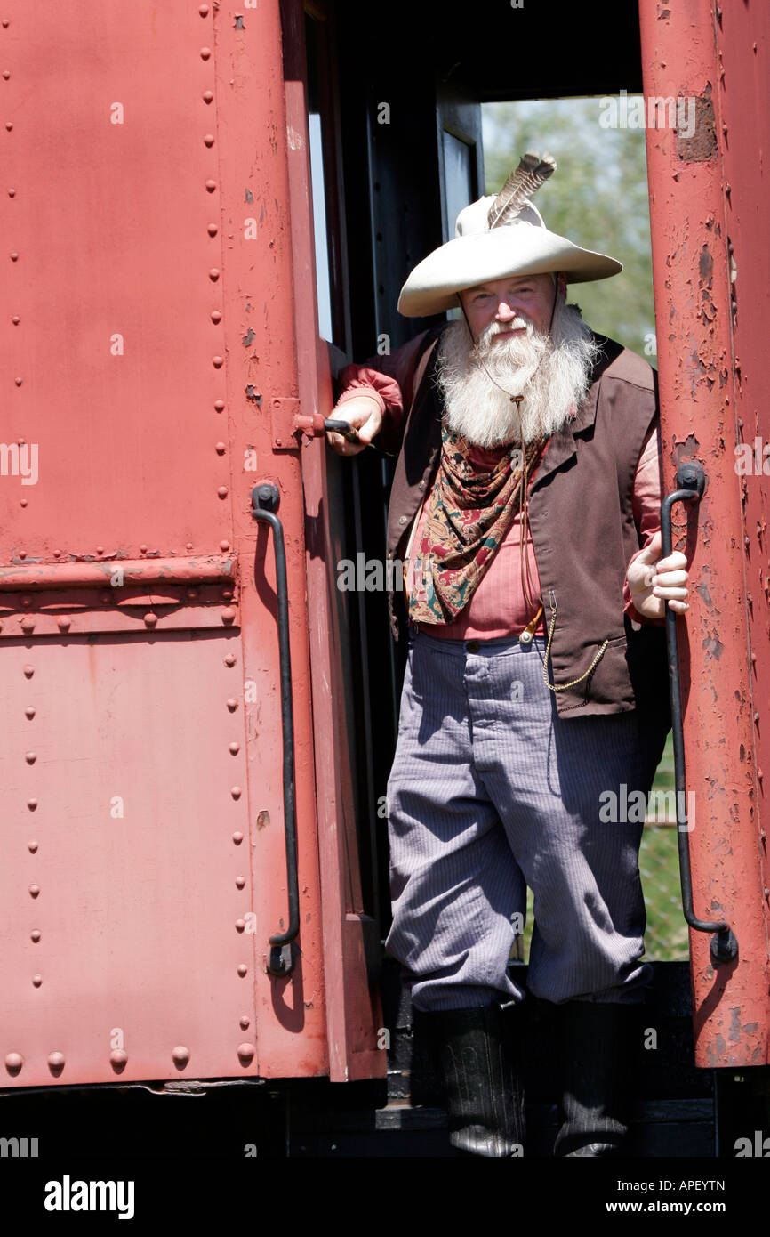 An old miner riding the train during an 1850 s reenactment Stock Photo