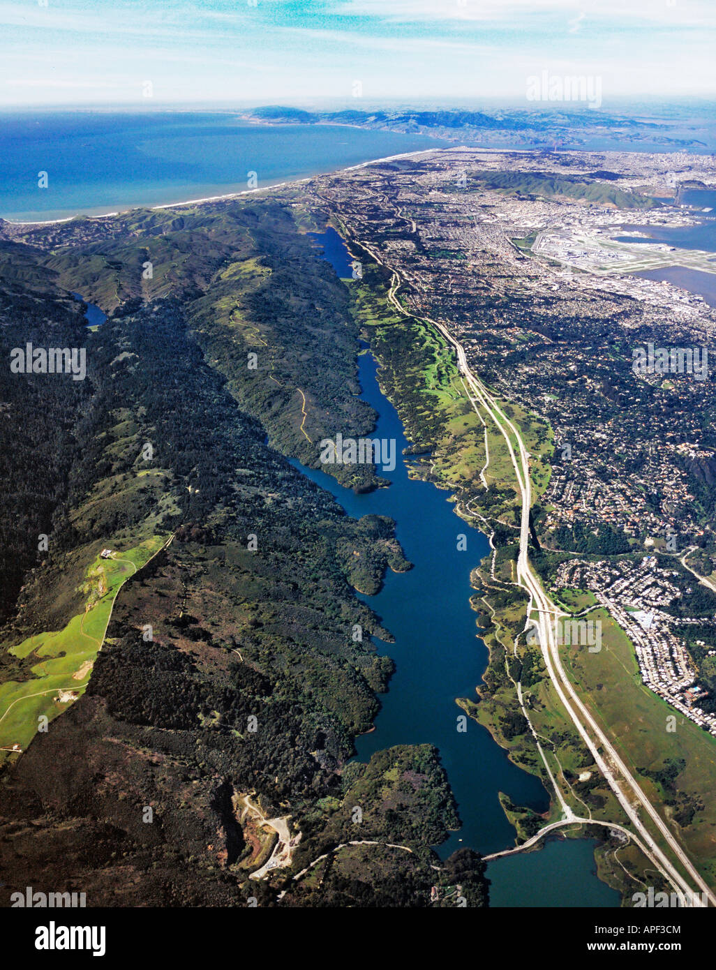 aerial above San Andreas fault line Crystal Springs reservoir CA interstate I-280 San Francisco and Pacific ocean in background Stock Photo