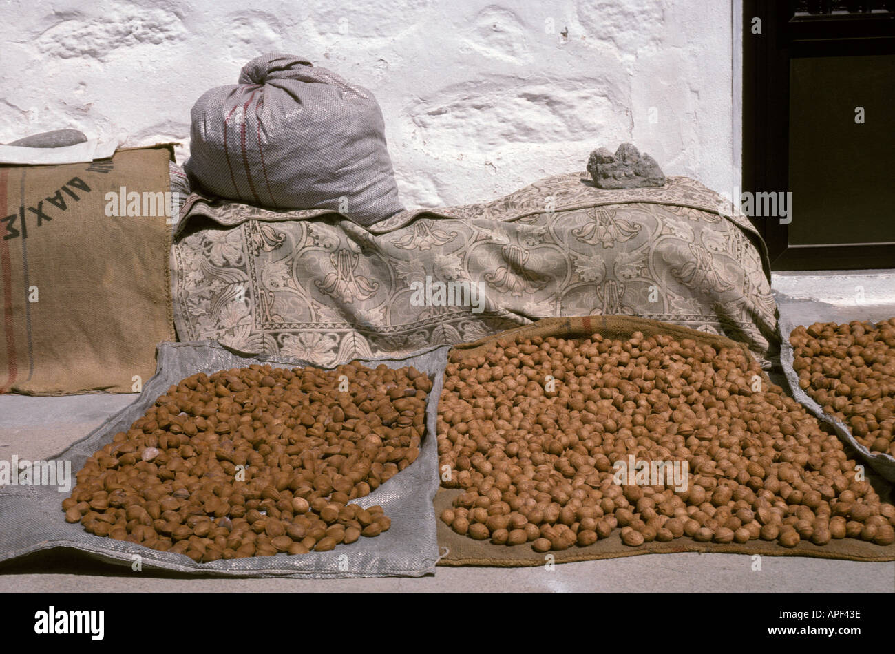 The September harvest of almonds on Lemnos is laid out in the sun to dry Stock Photo