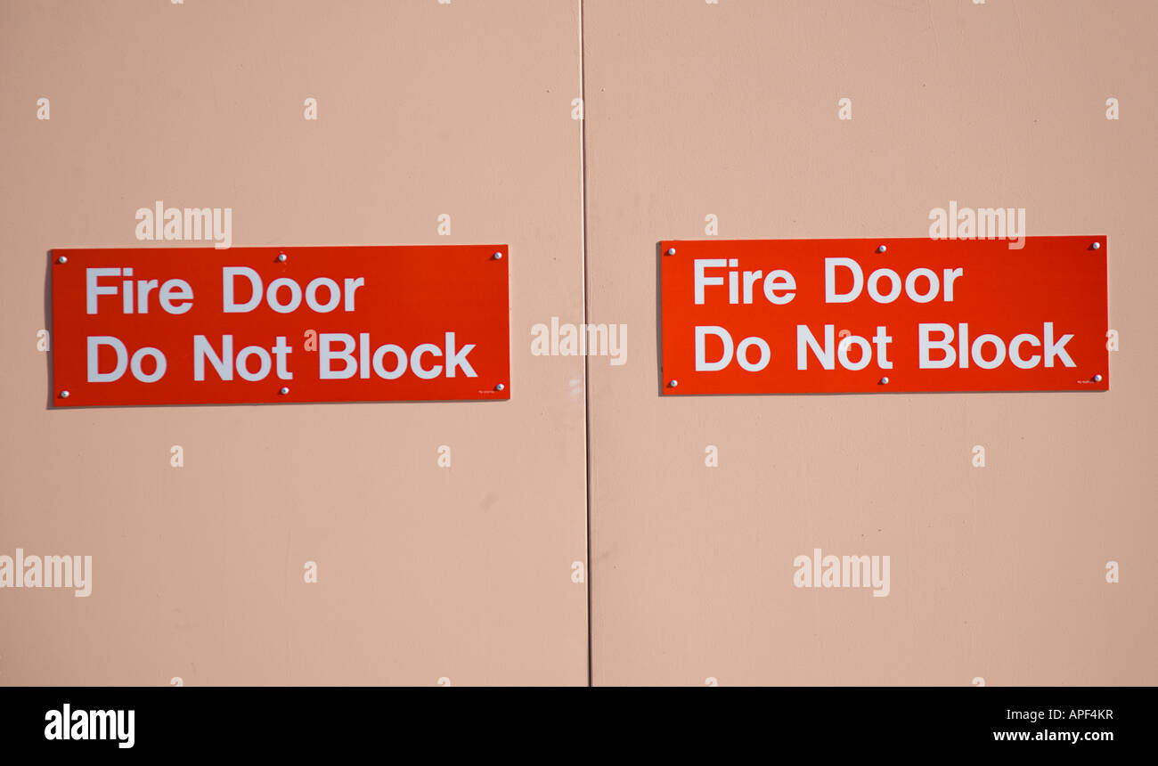 Fire door with warning Stock Photo