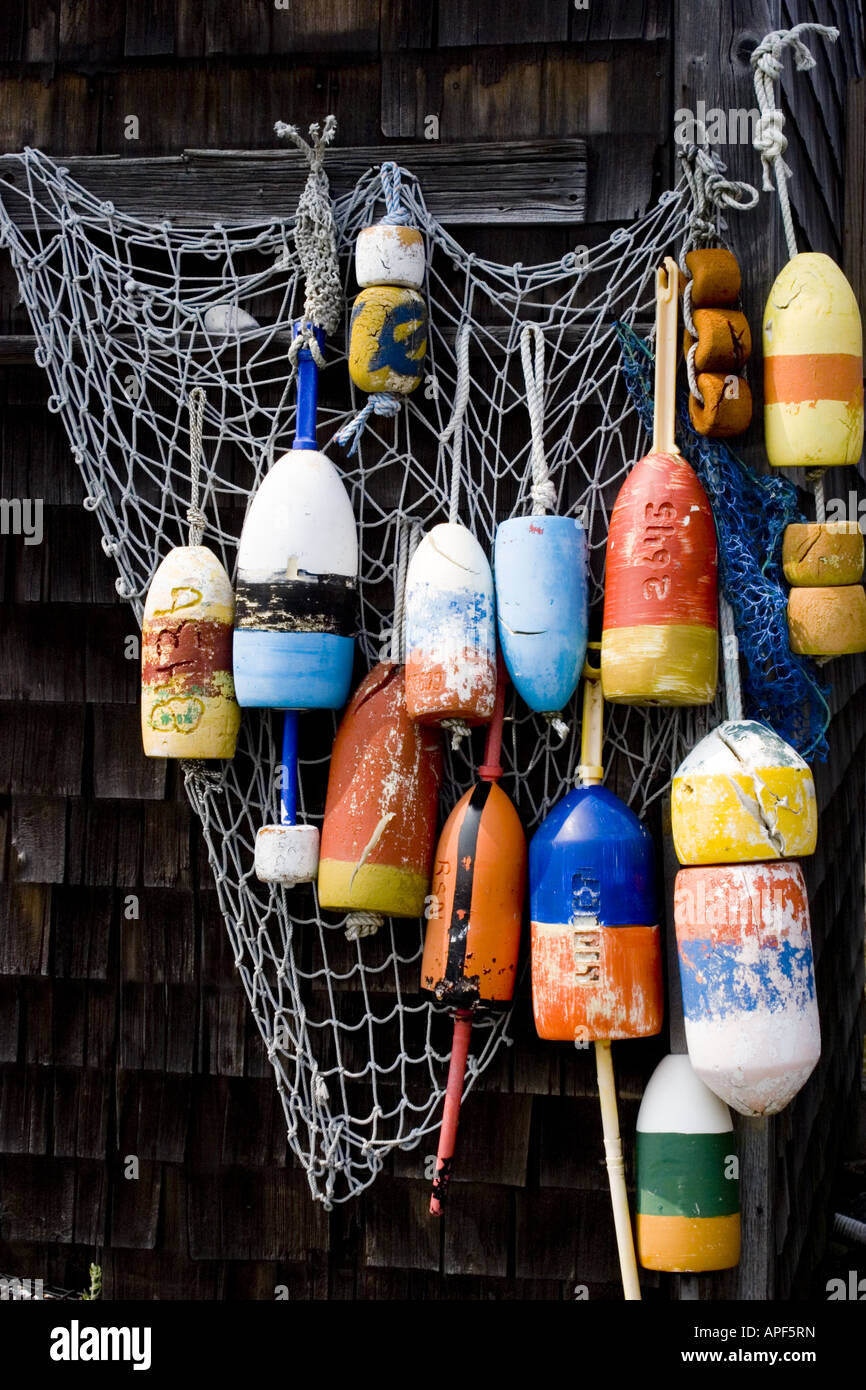 Wooden Lobster Trap Buoys hanging on a wall in Rockport, MA Stock Photo