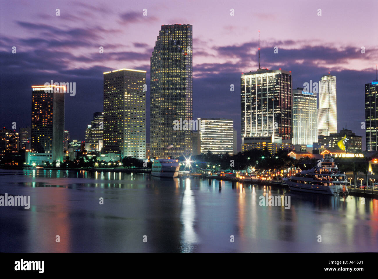 Downtown Miami Florida reflects on Biscayne Bay at dusk Stock Photo