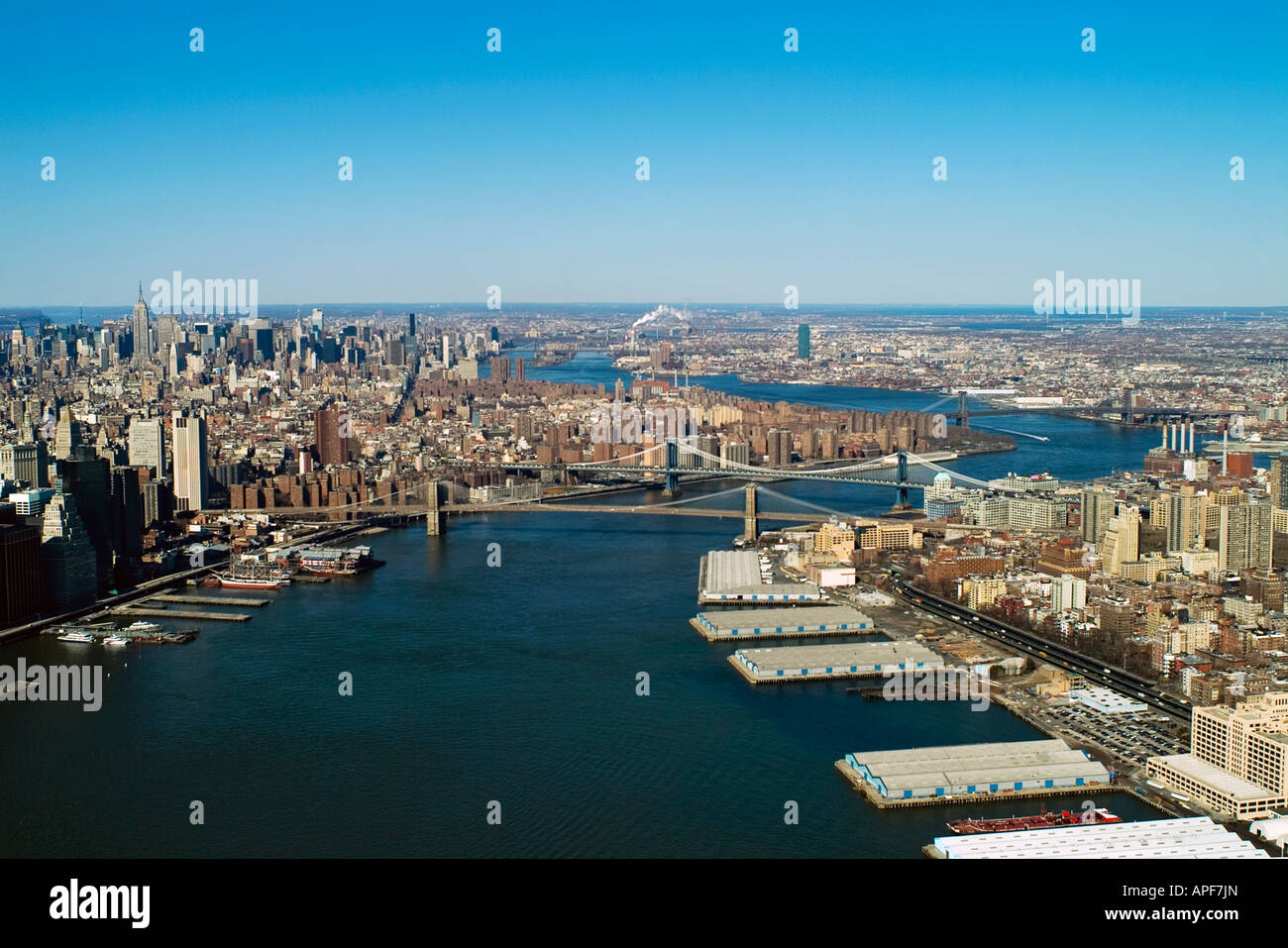 aerial view above New York city East River Manhattan left Brooklyn ...
