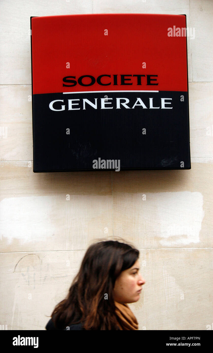 A woman walks past a Societe Generale bank in Rouen Seine Maritime France Stock Photo