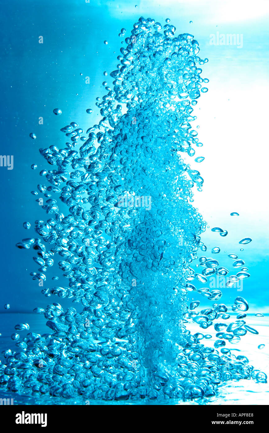 air bubbles water jet gets through water surface picture is turned by