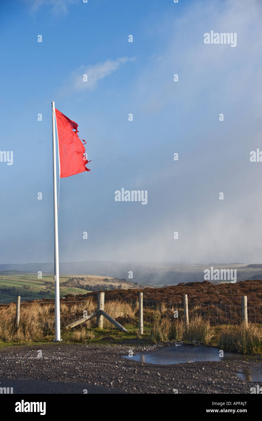 Red flag on the edge of Army training land in Swaledale, Yorkshire. Stock Photo