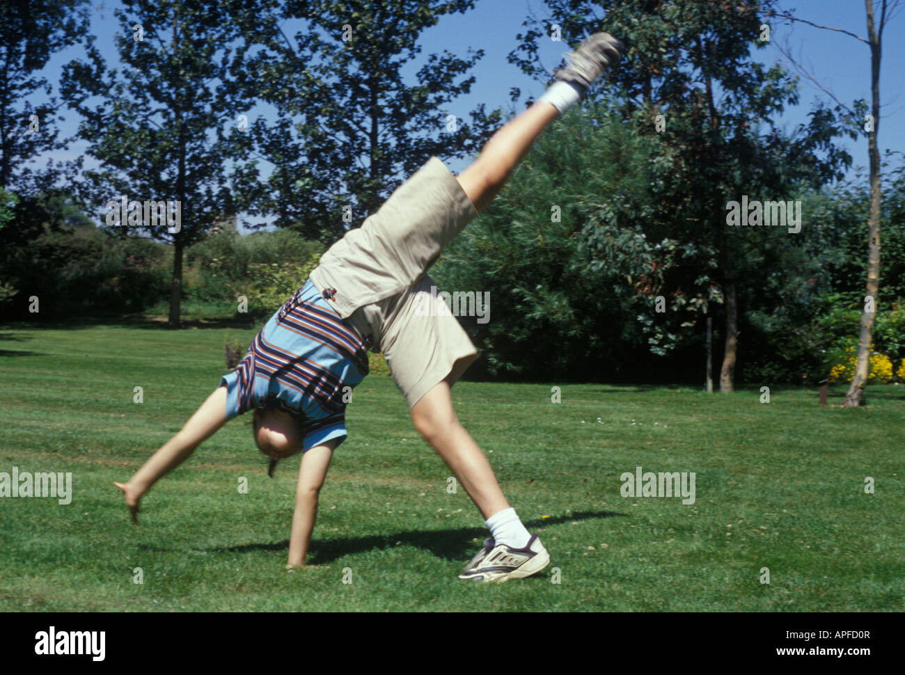 girl doing a cartwheel Stock Photo Alamy