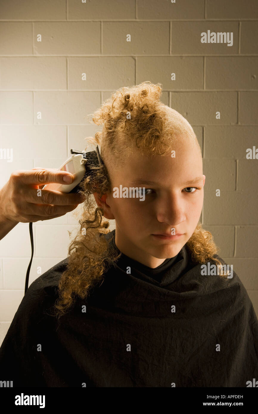 Getting hair shaved off Stock Photo