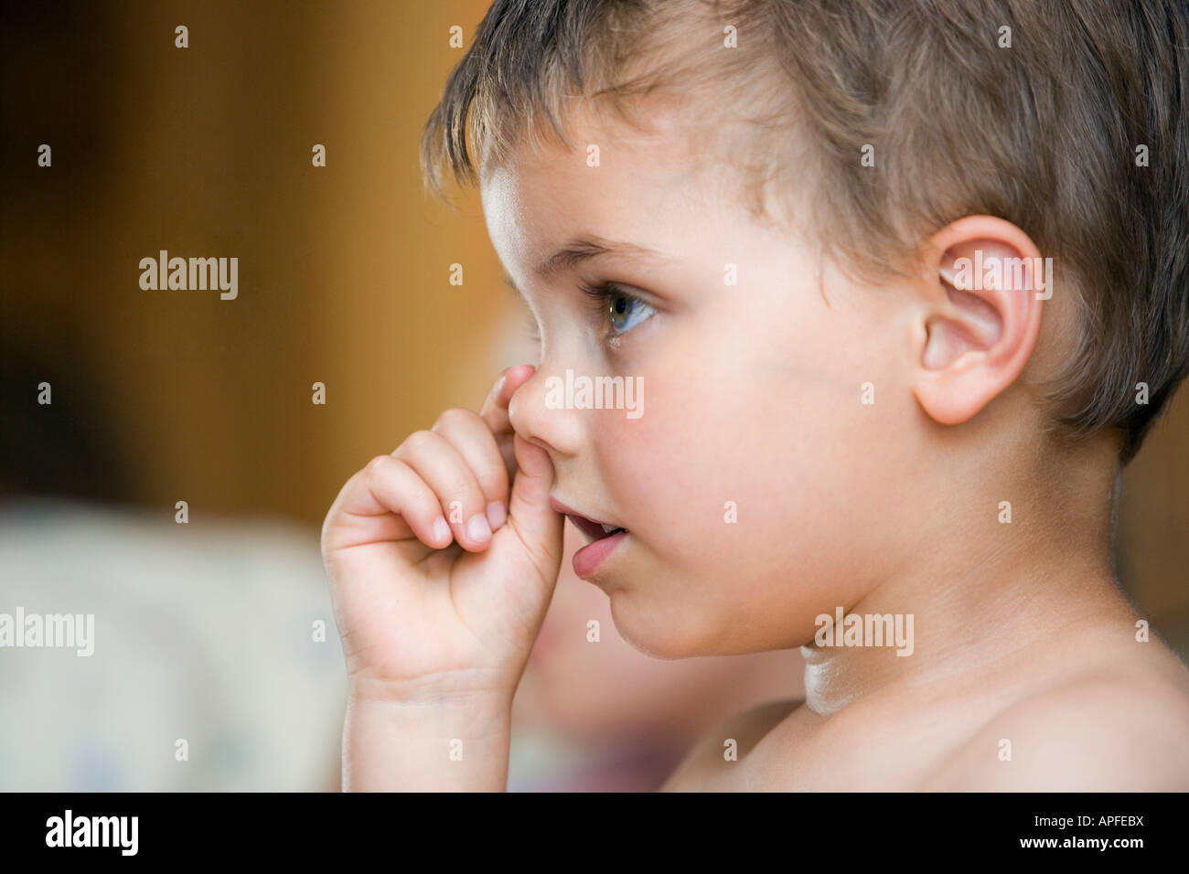 Little boy picking nose Stock Photo