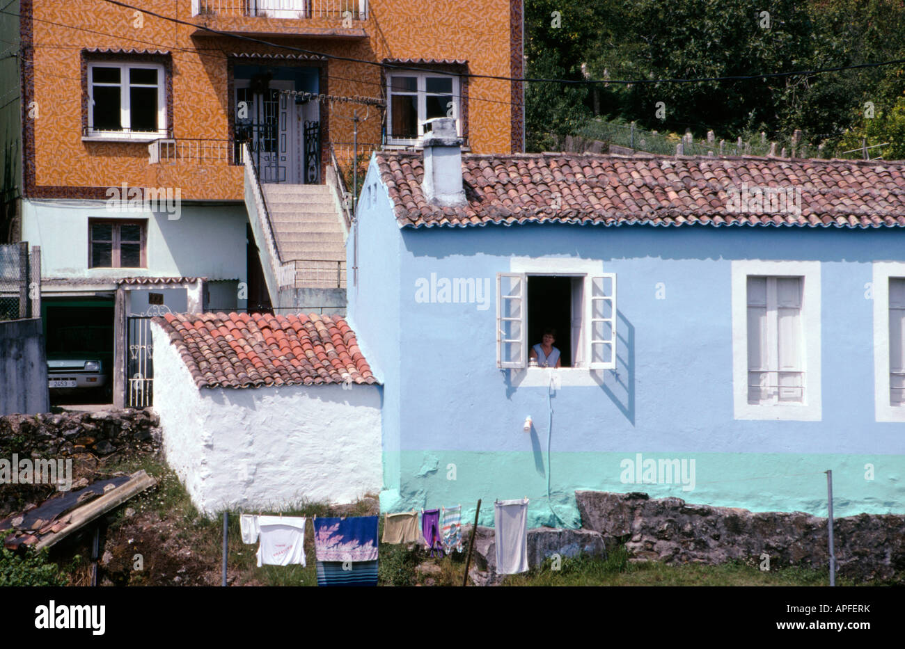 Typical houses tiled and or painted bright colours near Camarinas La Coruna province Galicia Spain Stock Photo
