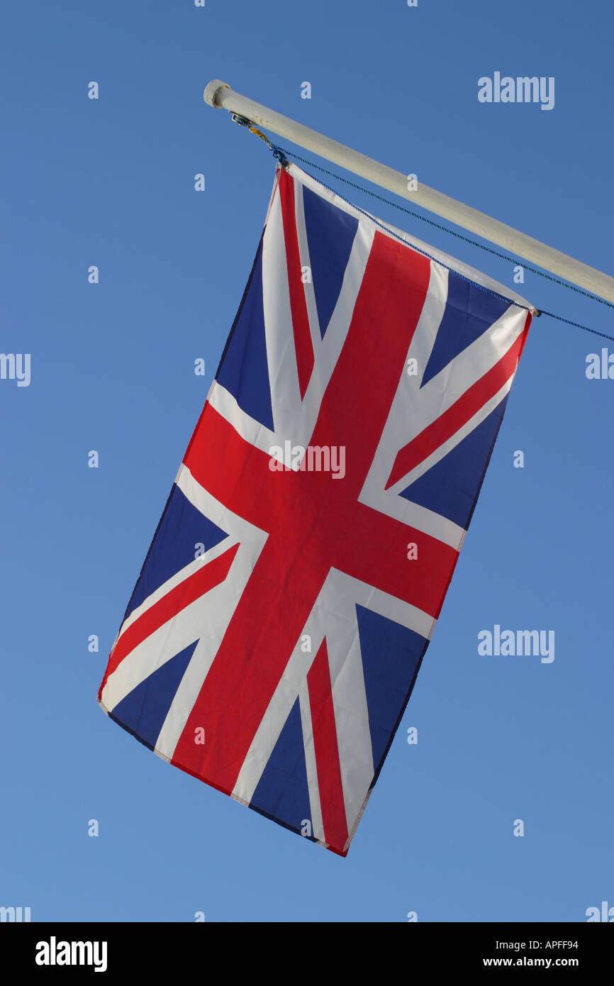 The Union Jack flag of Great Britain on diagonal flag pole Stock Photo