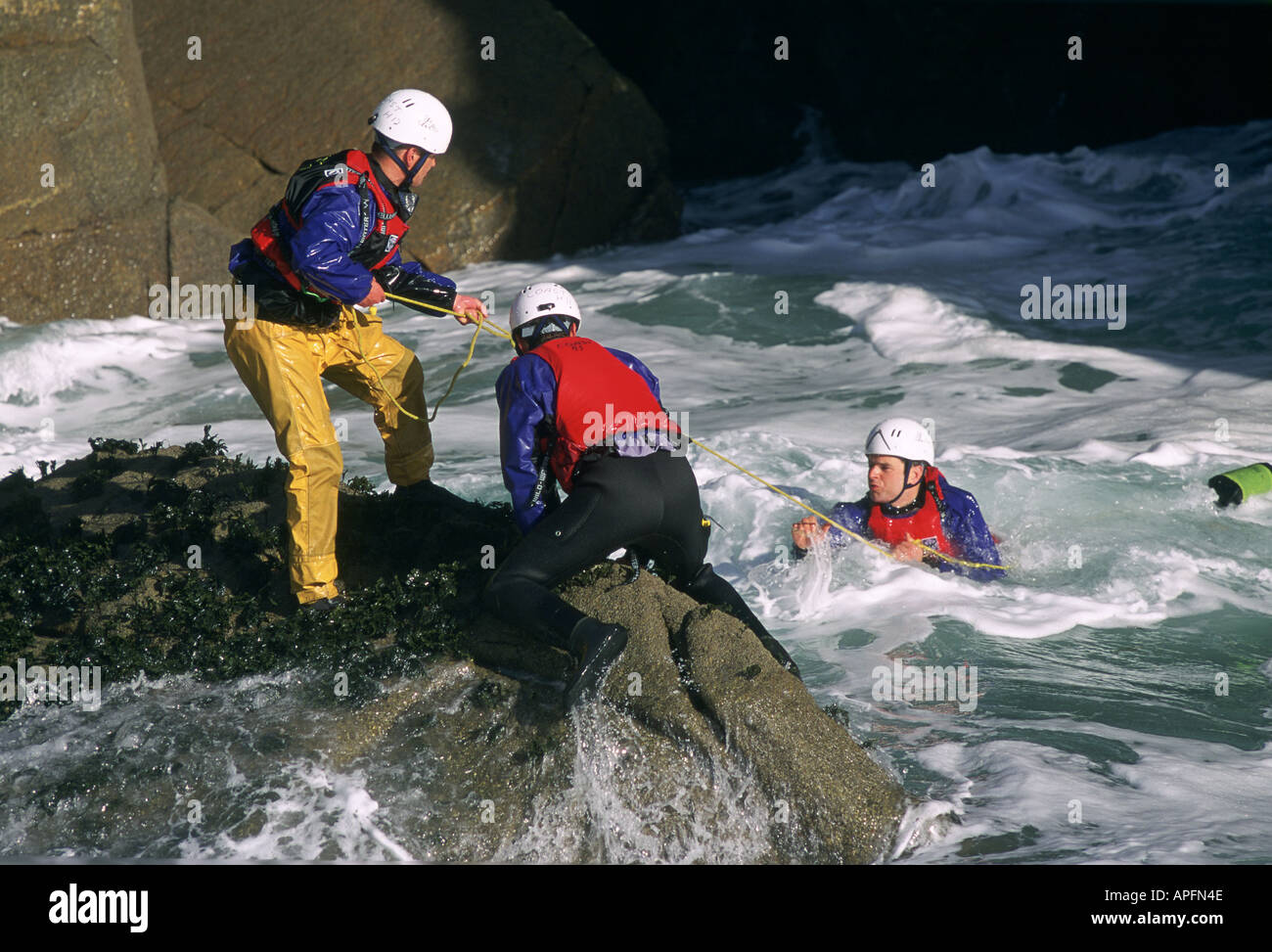 Three men pulled by rope hires stock photography and images Alamy