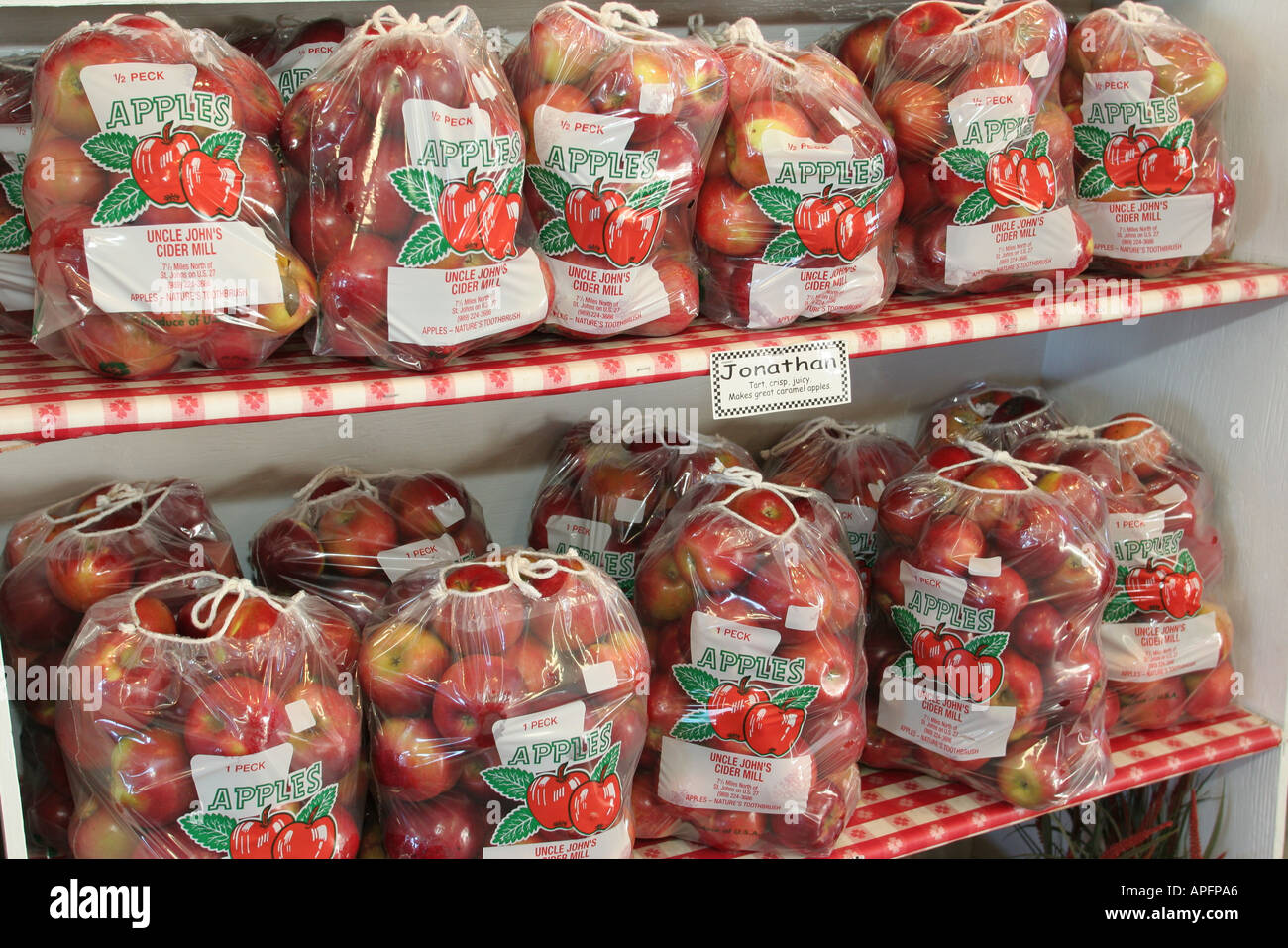 Michigan St. Johns,Uncle John's Cider Mill,apples for sale,peck,clear plastic bags,Jonathan,MI051018066 Stock Photo