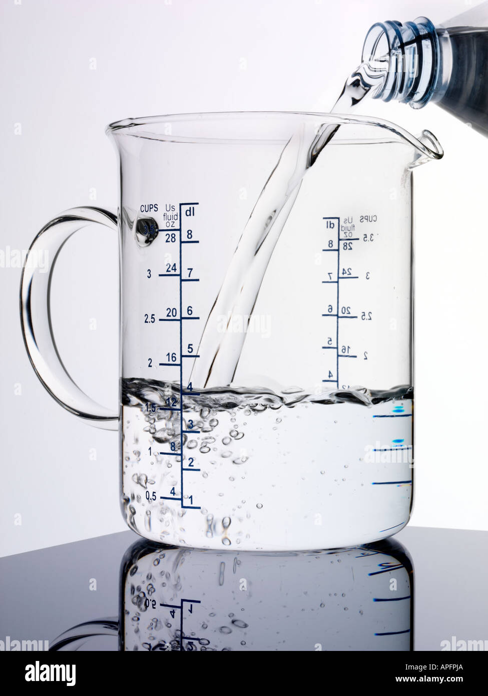JUG OF POURING WATER Stock Photo