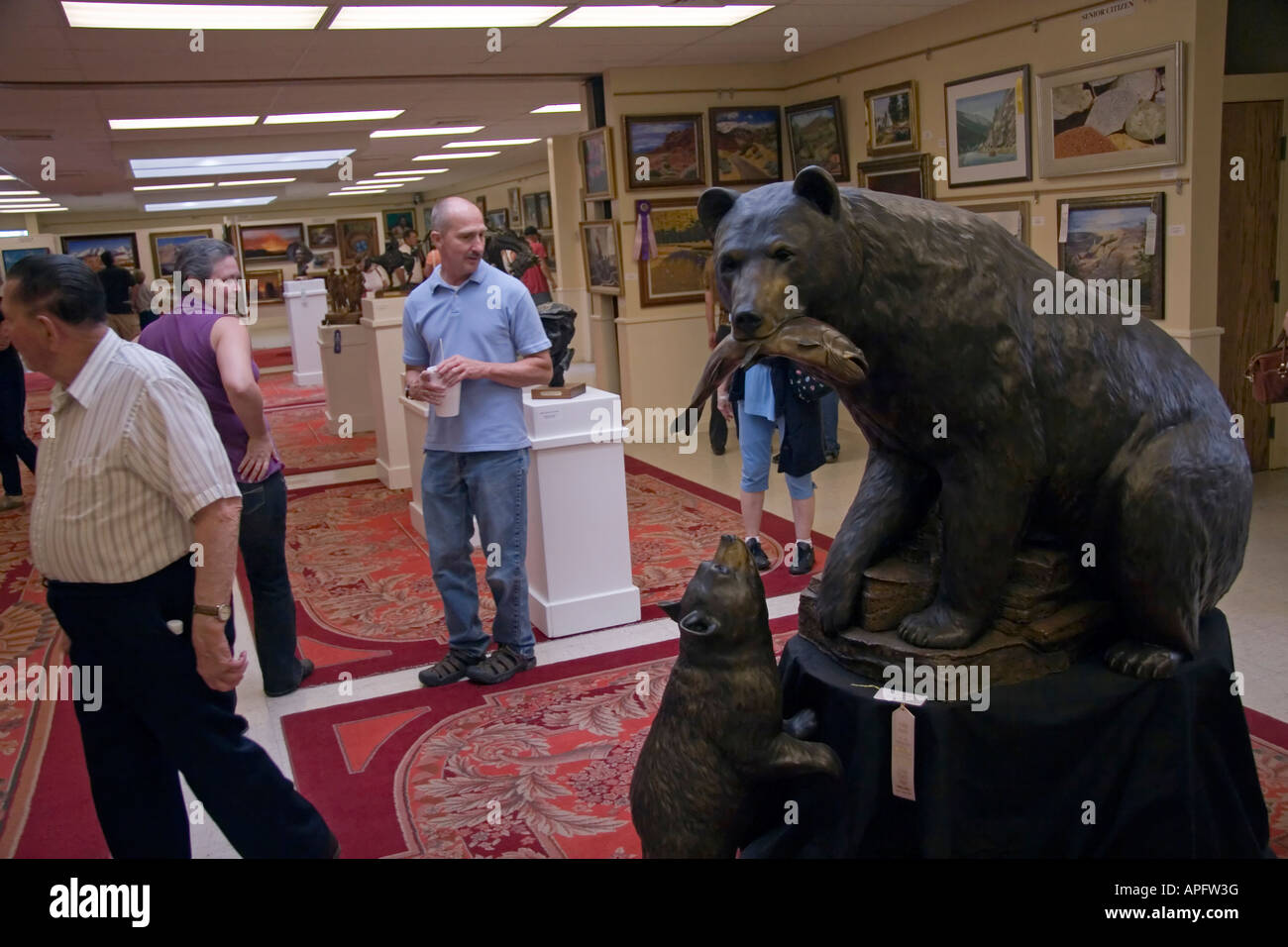People milling about & appreciating the many works of art on display at this Art Exhibit at the Utah State Fair in SLC, Ut., USA Stock Photo