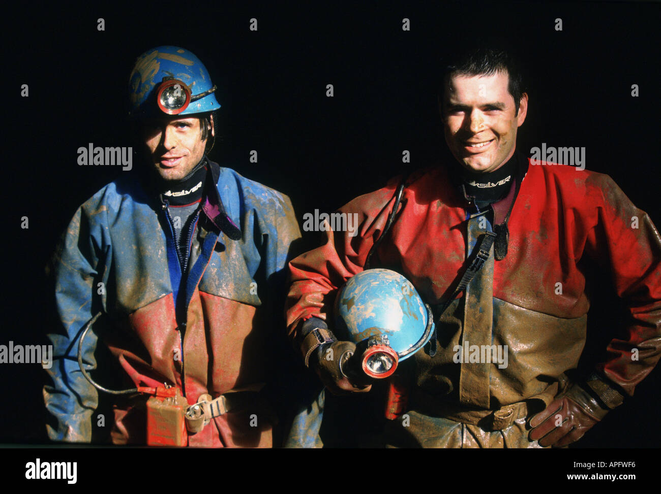 Portrait of pot holers with helmets, Devon, UK Stock Photo