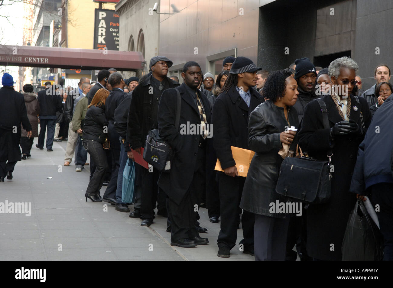Hundred queue up at a Job Fair at The New Yorker Hotel in NYC Stock Photo