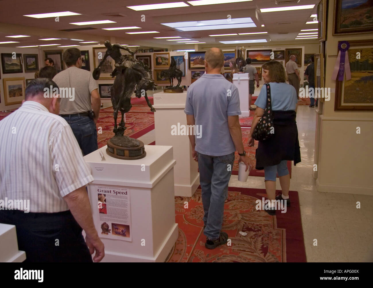 People milling about & appreciating the many works of art on display at this Art Exhibit at the Utah State Fair in SLC, Ut., USA Stock Photo
