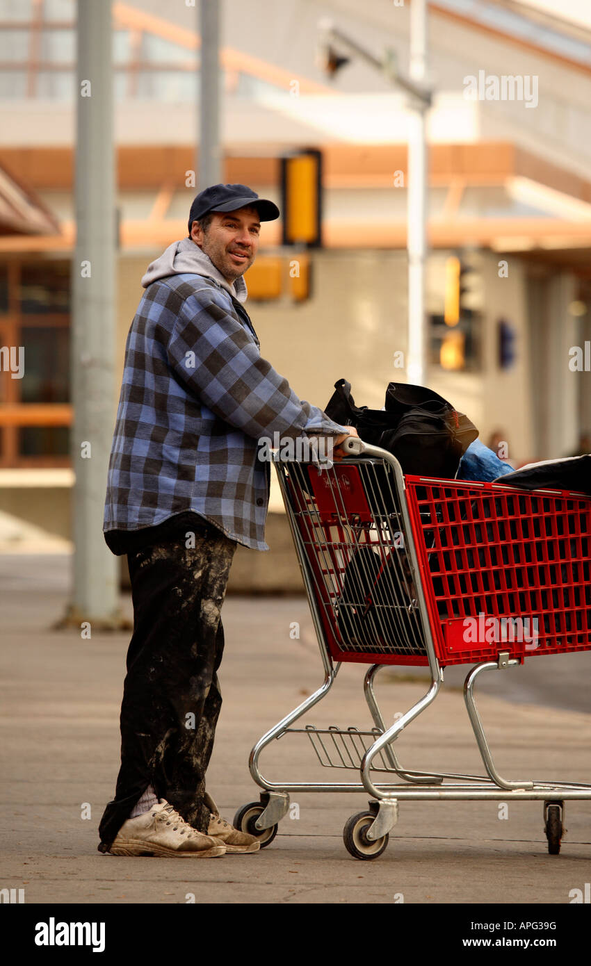 Homeless Man Pushing Shopping Cart High Resolution Stock Photography