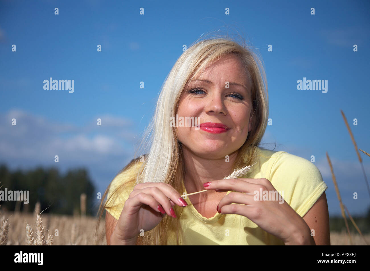 Beautiful Girl in wheat field Stock Photo - Alamy