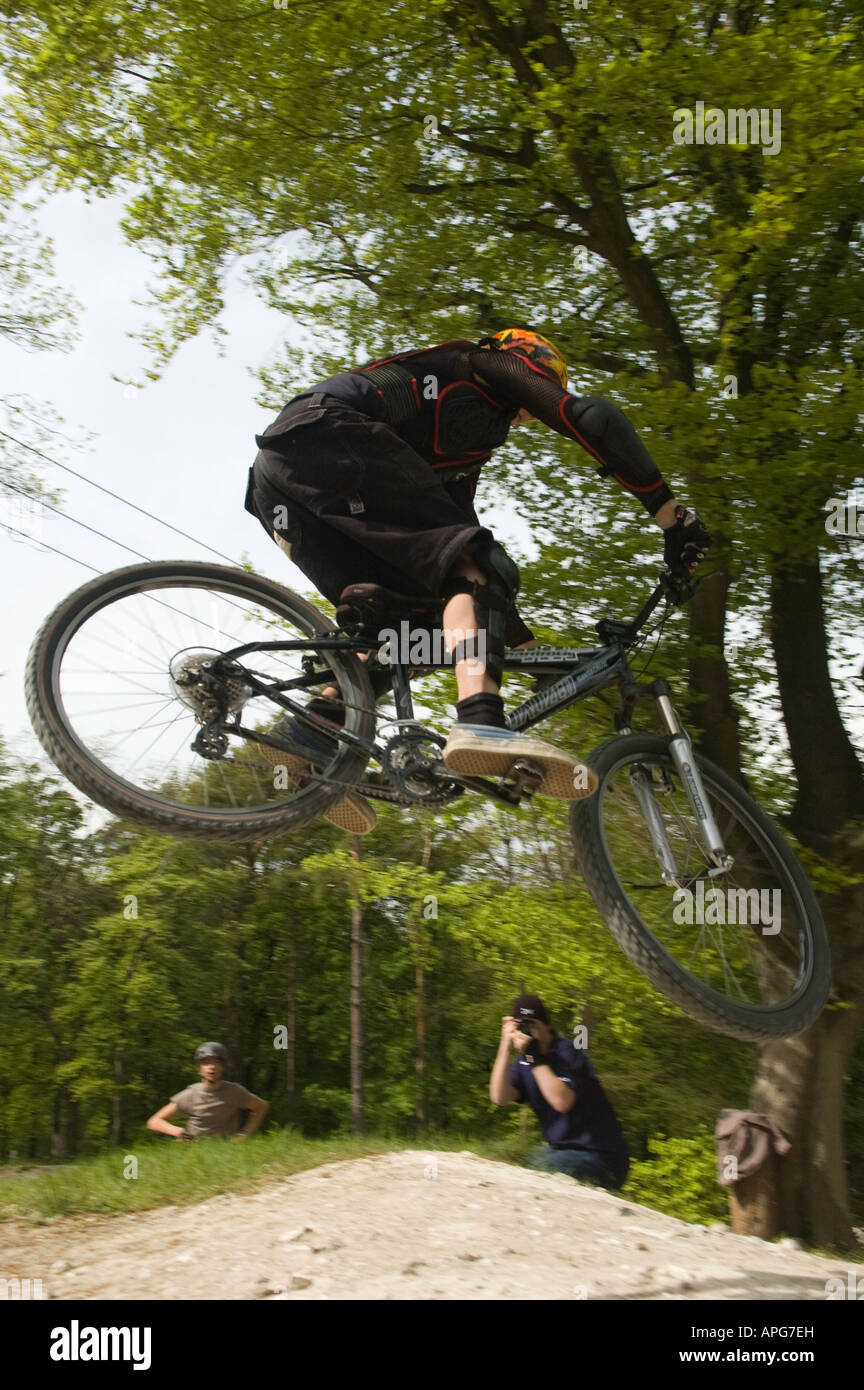 Downhill mountain biker in mid air, 'taking some air' Stock Photo