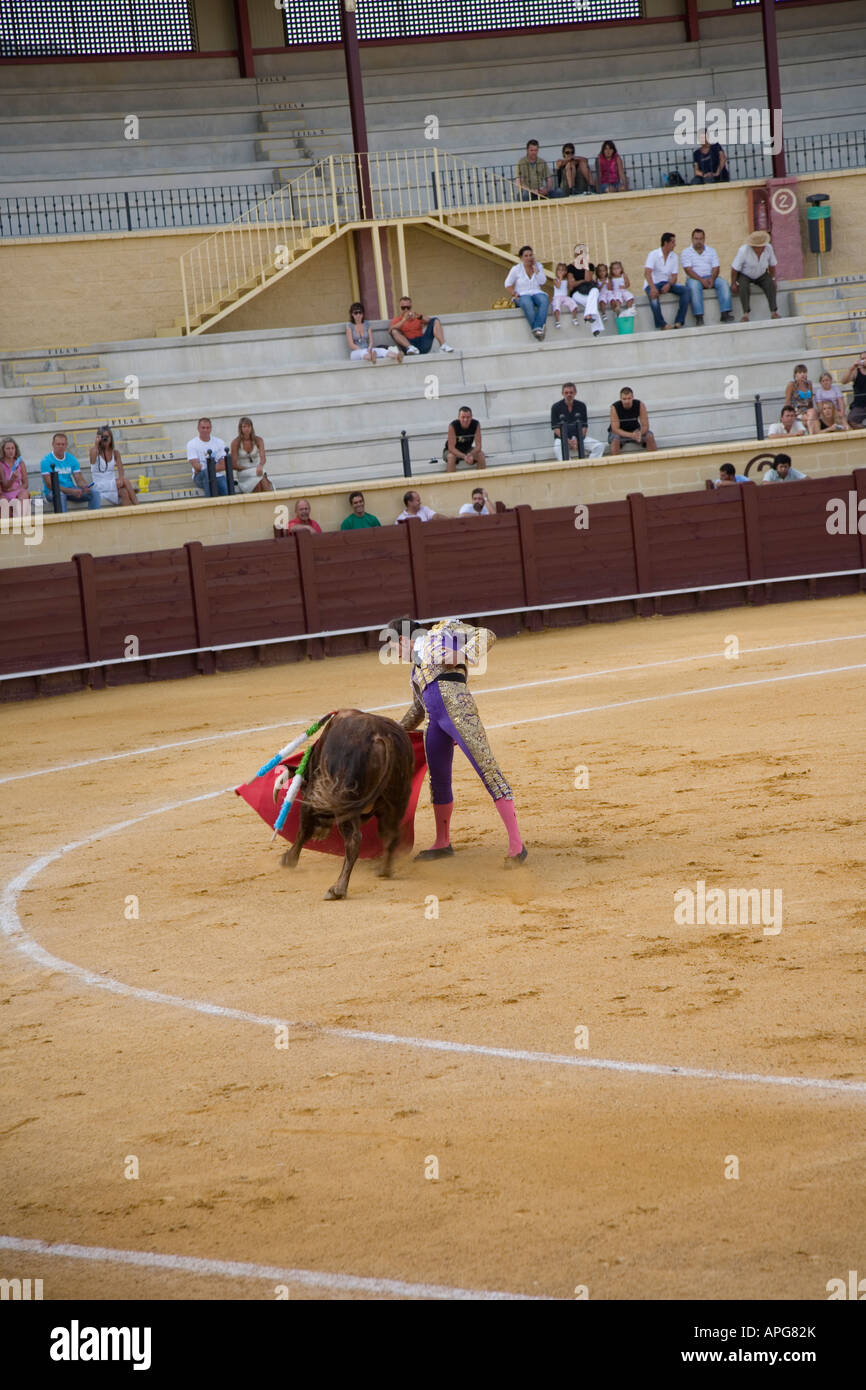 Matador And Bull In Ring He Swirls His Red Cape In Torremolinos Stock Photo Alamy