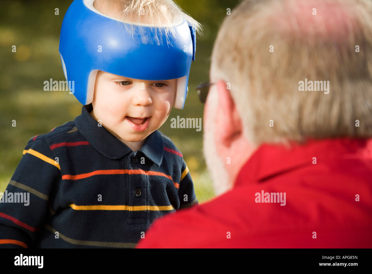 Grandpa playing with grandson Stock Photo Alamy