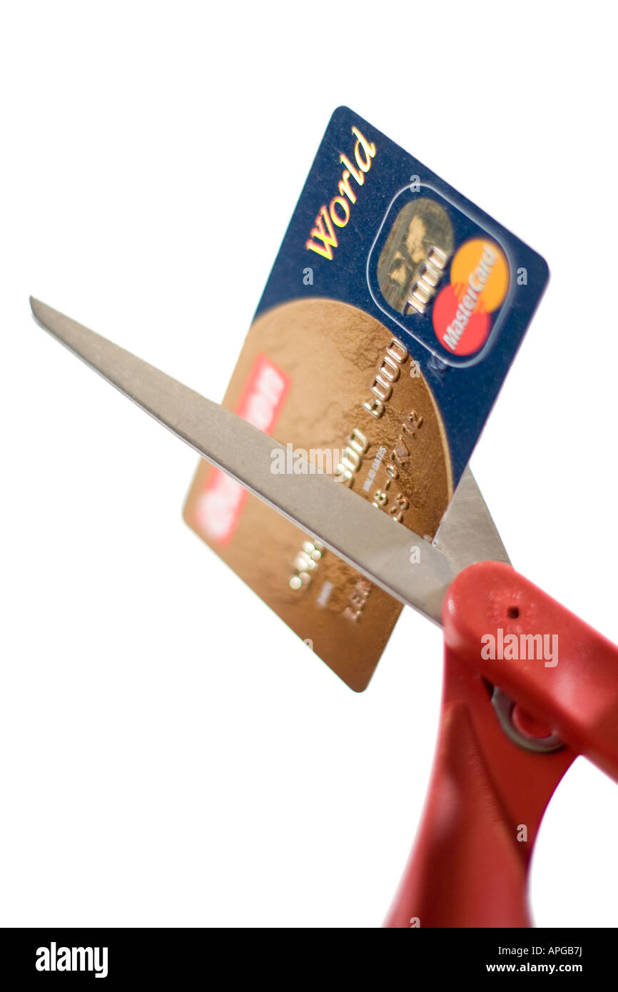 Scissors cutting a credit card indicating bad credit consumer debt and