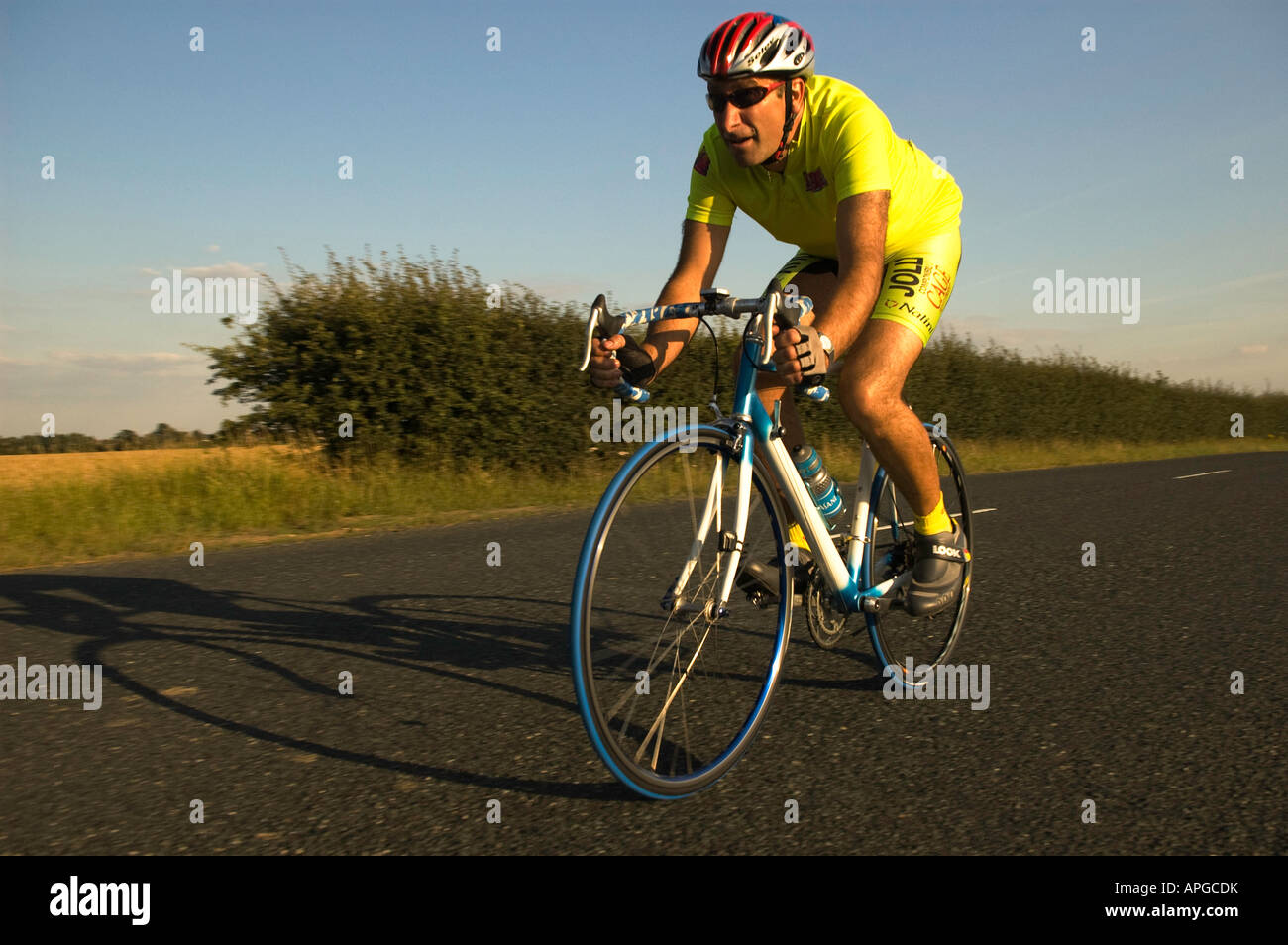 Cyclist participating in a time trial in the lanes around Ely in Cambridgeshire Stock Photo