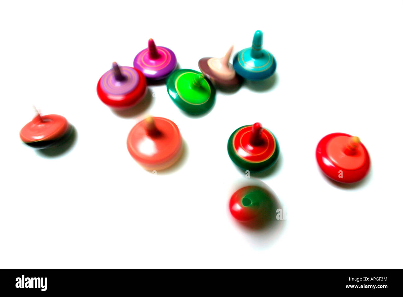 Spinning tops on a white background Stock Photo Alamy
