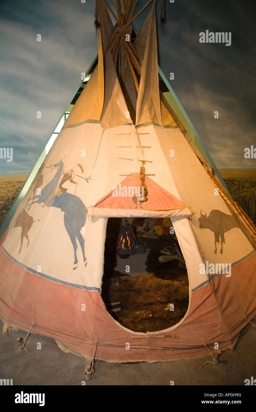 ILLINOIS Rockford Drawings and entrance to tipi Native American mobile house made from animal skins stretched hunting scene Stock Photo