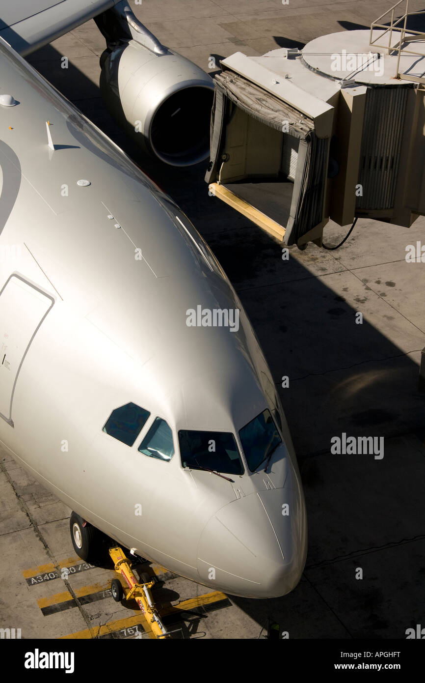 View from above, airplane and passenger loading ramp detaching from