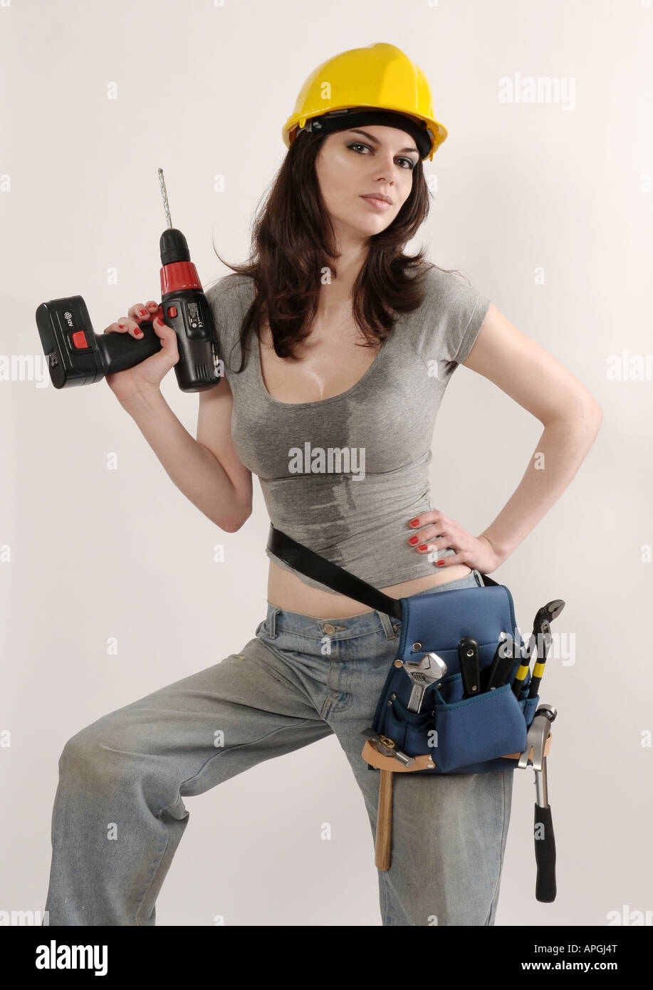 Sexy builder girl holding a drill Stock Photo