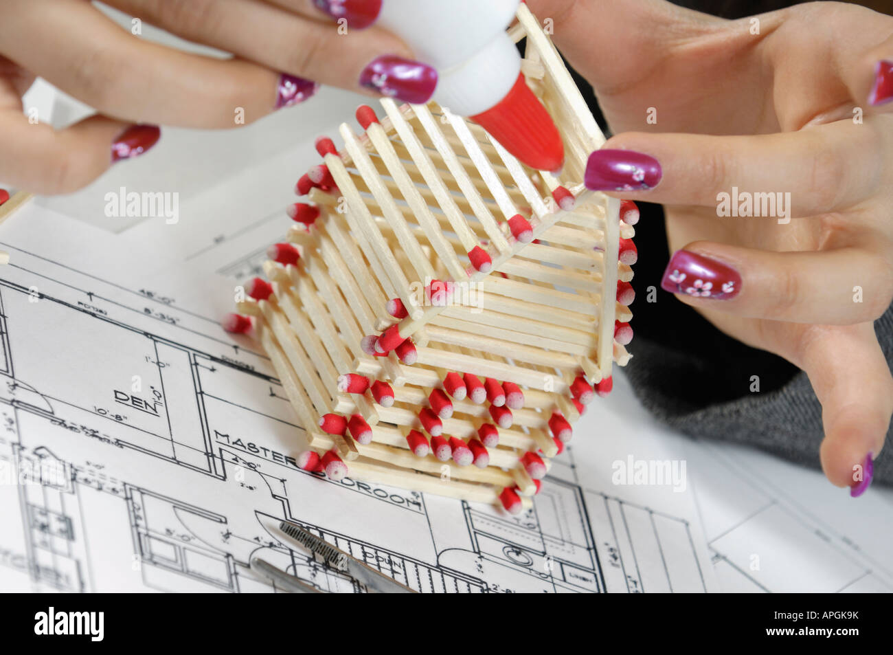 Building a house from matches Stock Photo Alamy