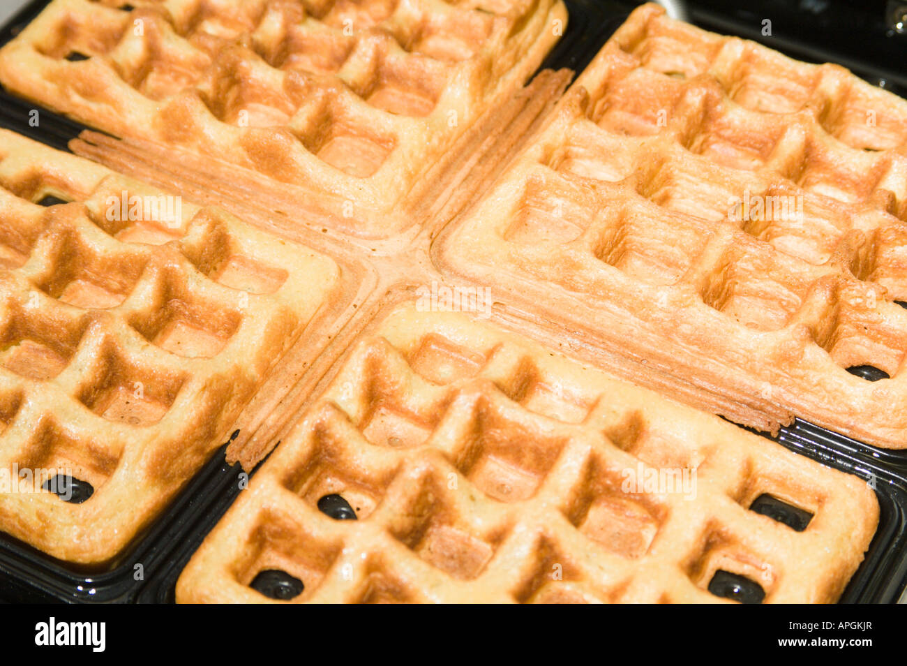 waffles in waffle iron Stock Photo Alamy