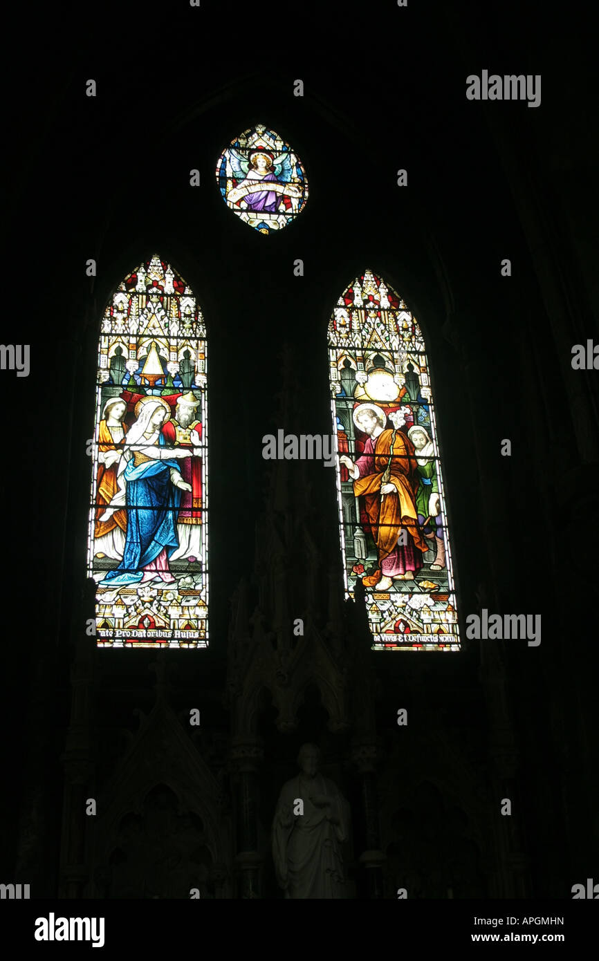 stained glass windows of Irish catholic church Stock Photo - Alamy