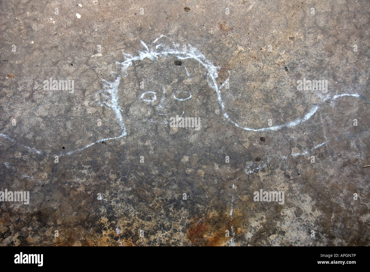 Childlike chalk outline drawing on concrete floor Stock Photo