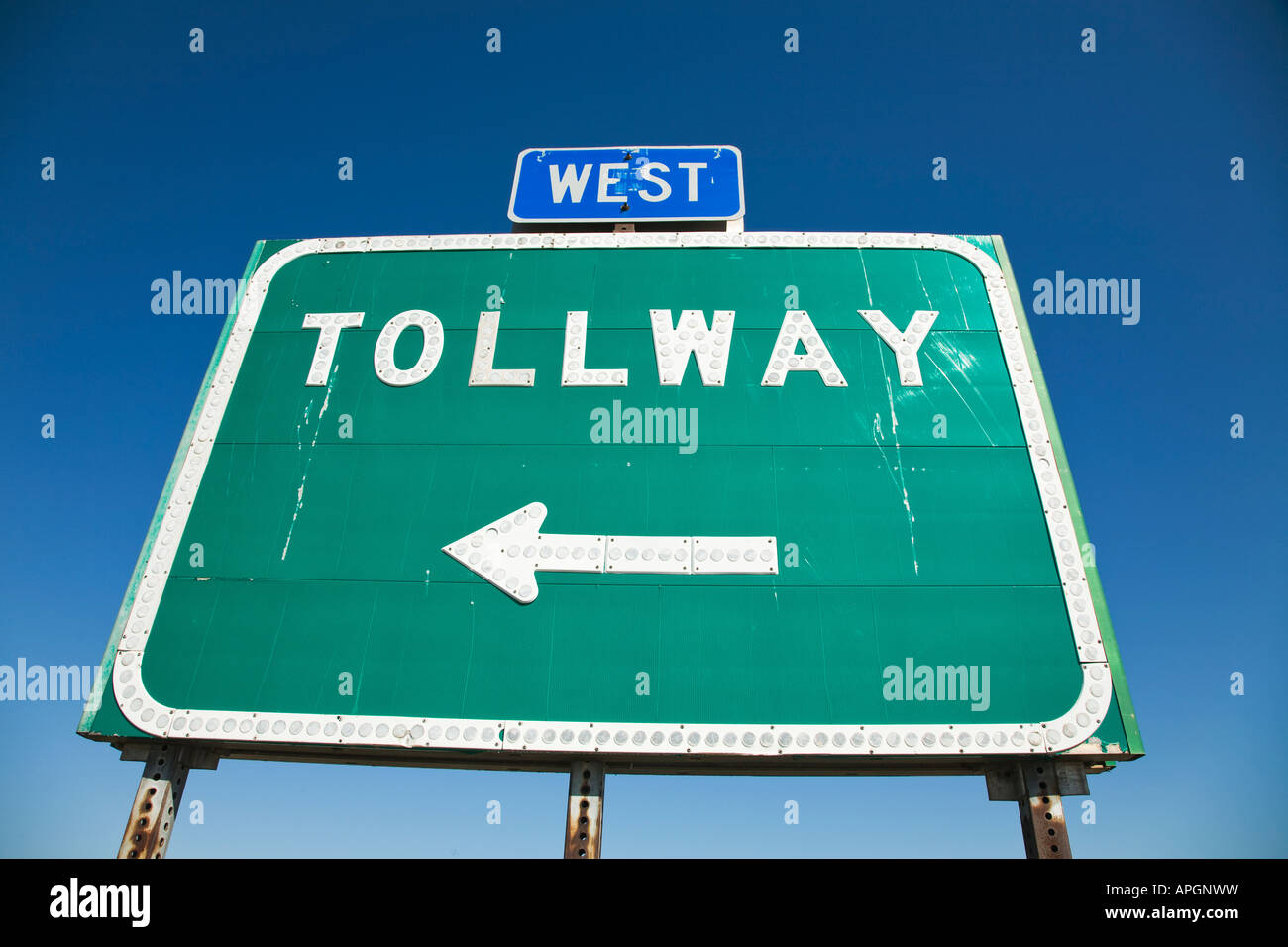 ILLINOIS DeKalb Green rectangular sign with arrow pointing to tollway west direction Stock Photo