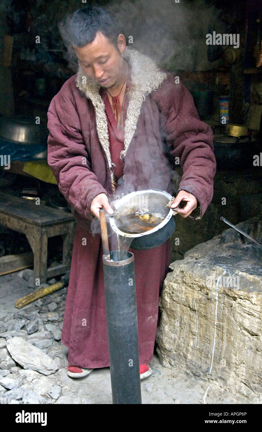 Buddhist monk making chai (tibetan tea). Pocho Gompa. Manang. Annapurna