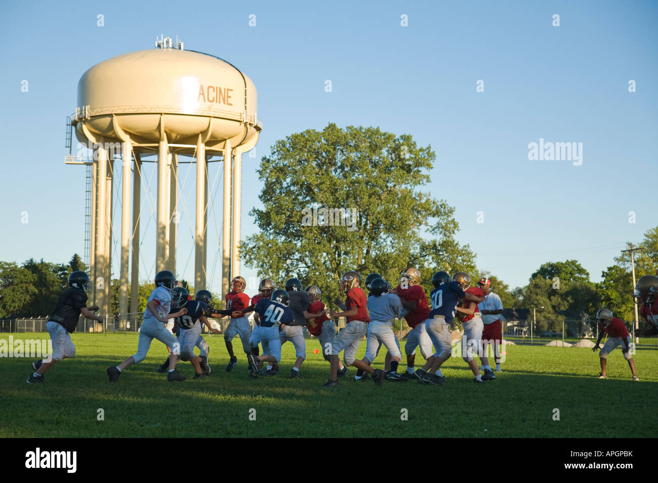 WISCONSIN Racine Junior high boys playing football game in field water