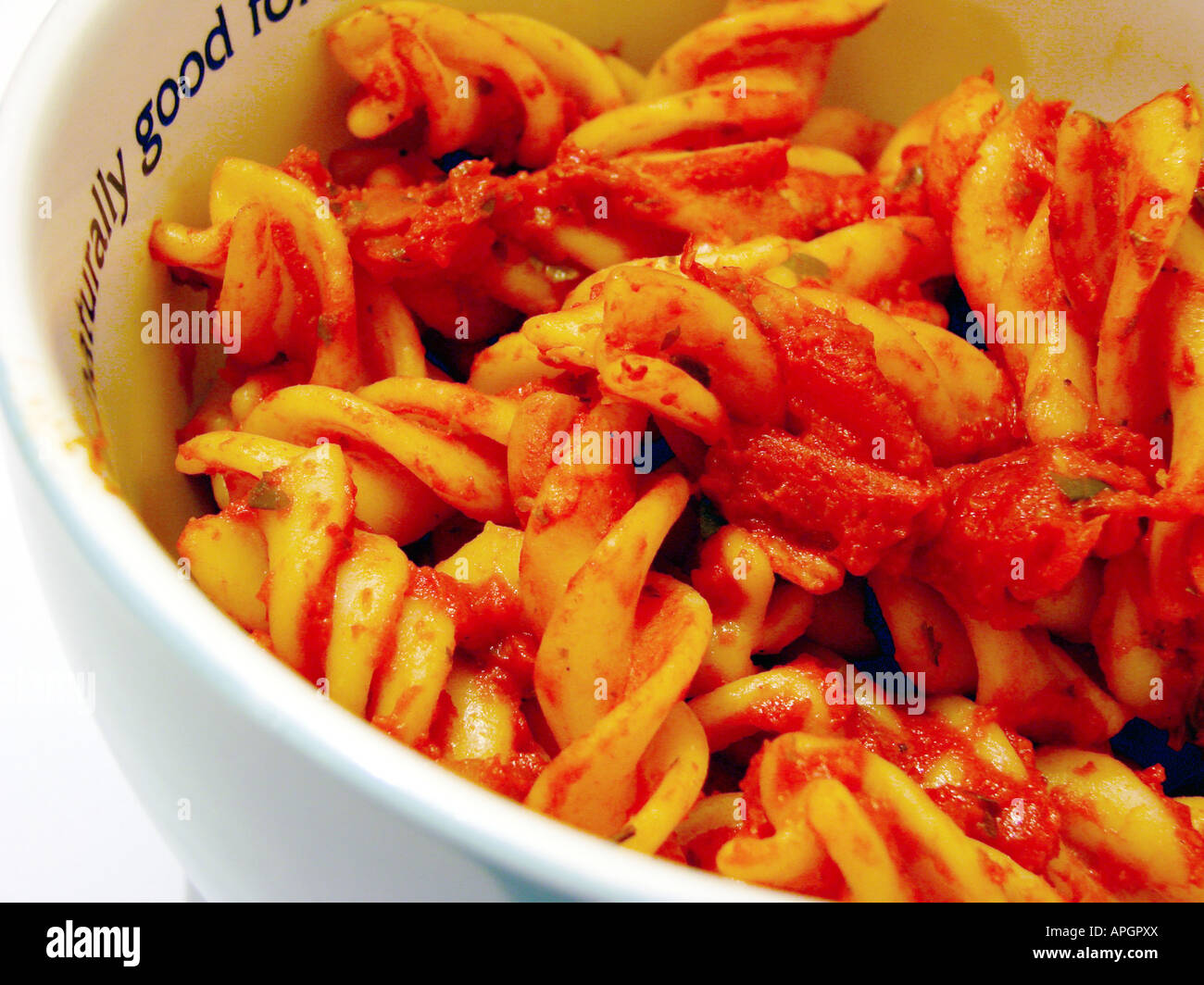 Pasta covered in Tomato and Basil Sauce Stock Photo - Alamy