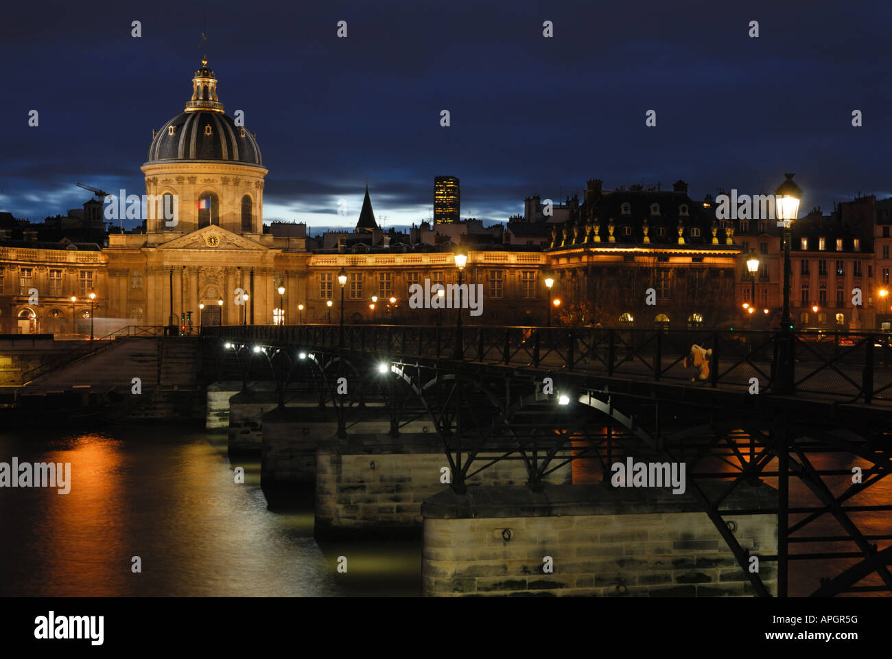 The French Institute and the Ponts des Arts by a cloudy evening, Paris Stock Photo