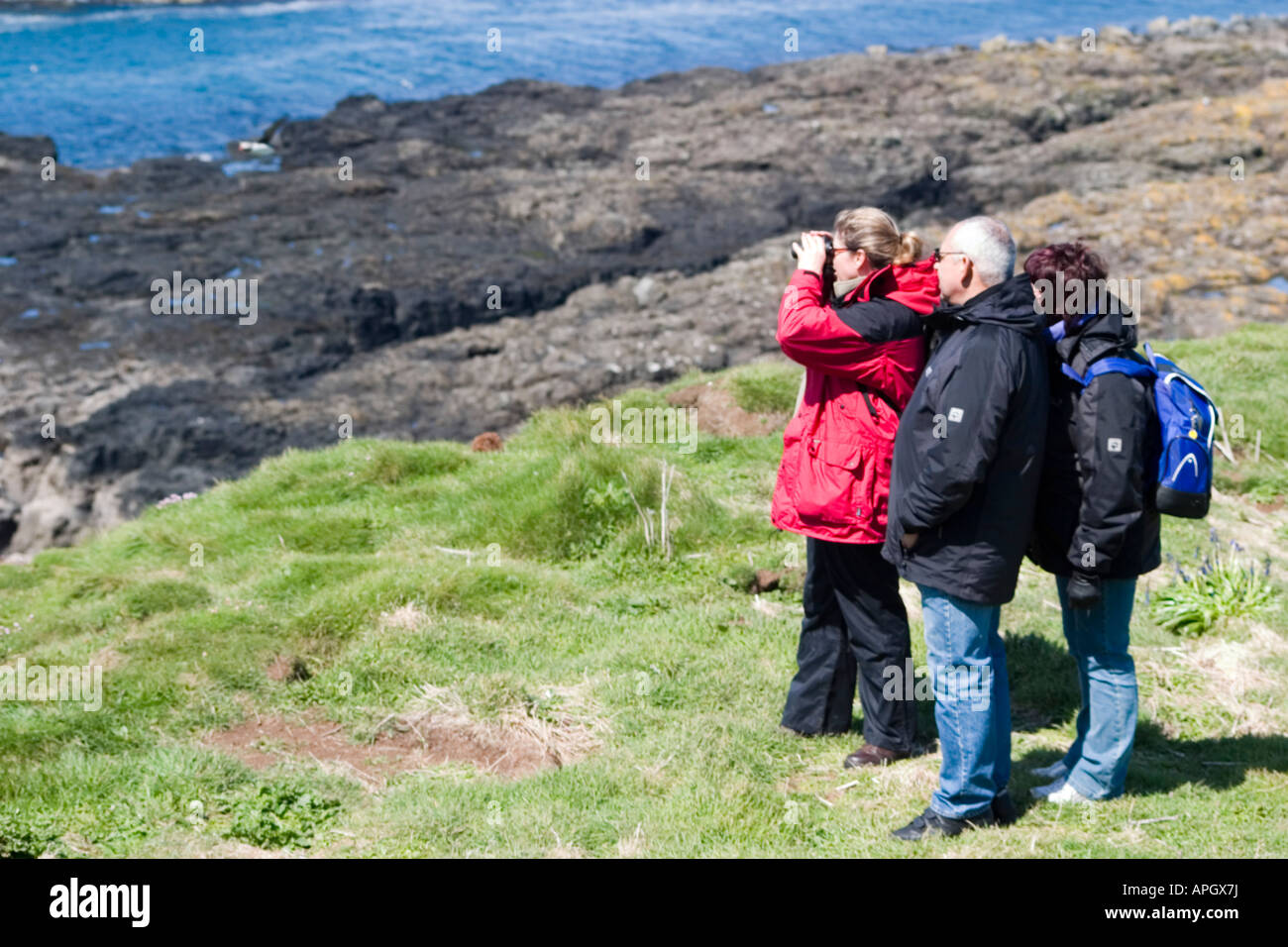 Birdwatchers on Lunga Treshnish Isles near The Isle of Mull Scotland June 2007 Stock Photo