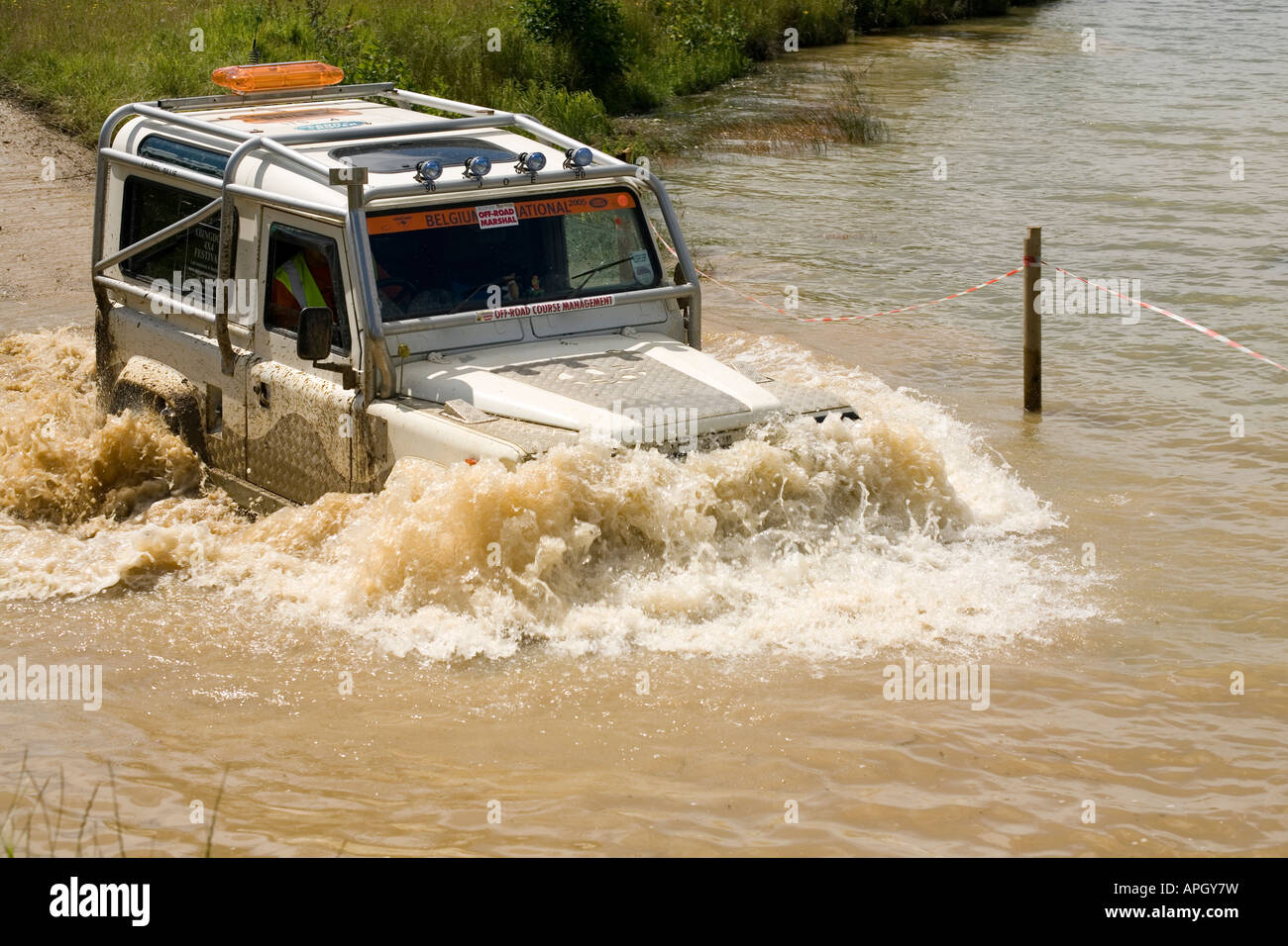 Landrover Defender fording river Stock Photo Alamy