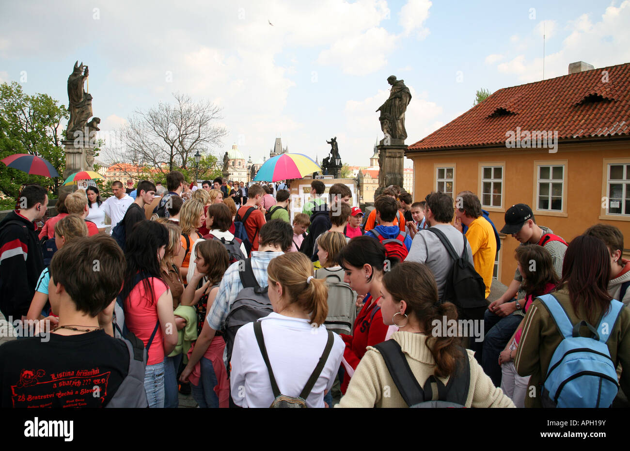 Prague tourism; Crowds of tourists crossing the Charles Bridge, Prague, Czechia Europe Stock Photo