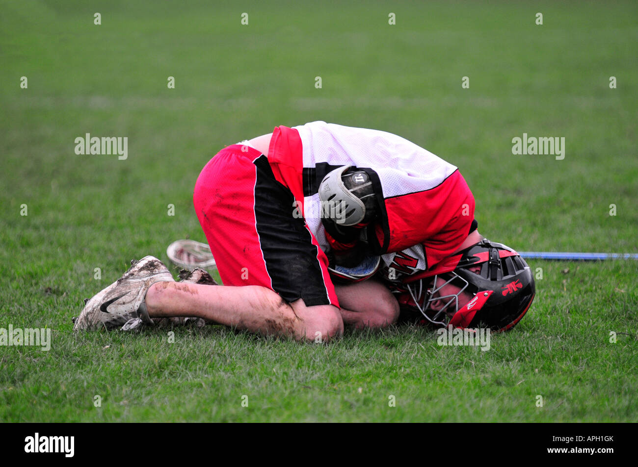 lacrosse player in pain Stock Photo - Alamy