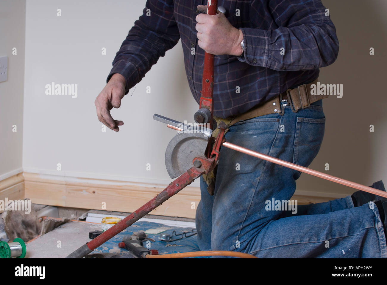 Copper pipe in plumbers pipe bender Stock Photo Alamy