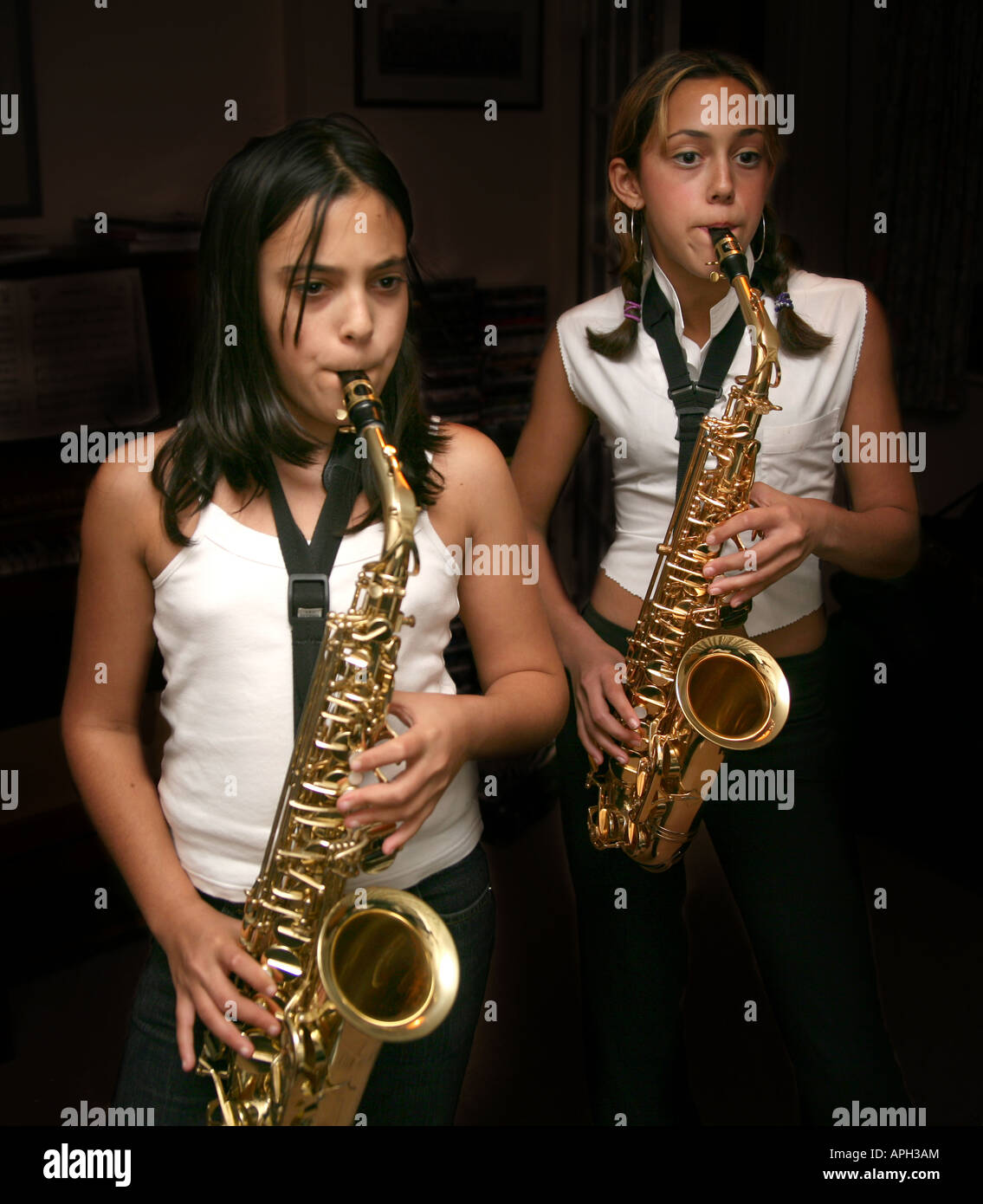 Two girls playing saxophones Stock Photo Alamy