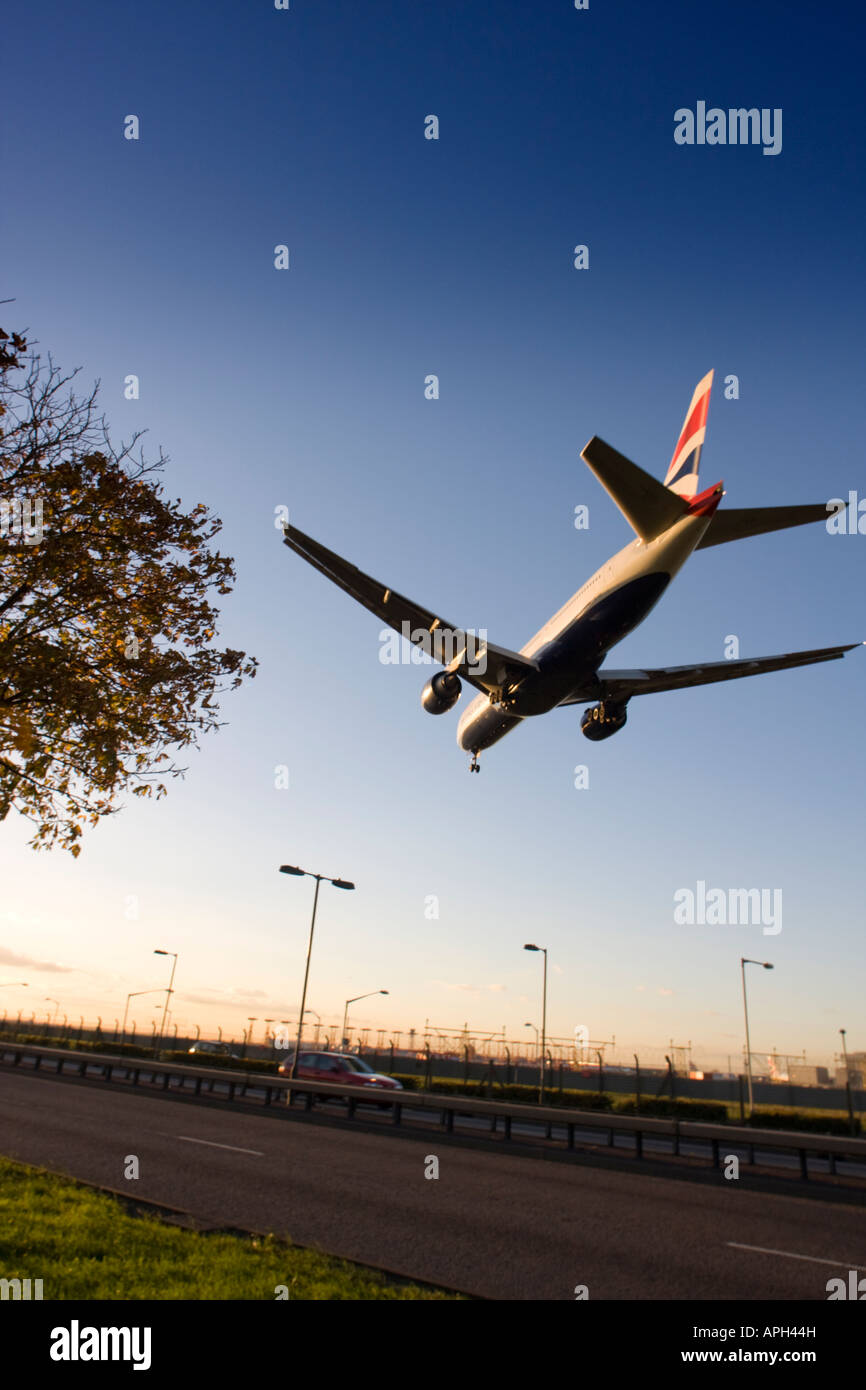 British Airways Boeing 777-236ER coming to land on runway 27L at London Heathrow Airport UK Stock Photo