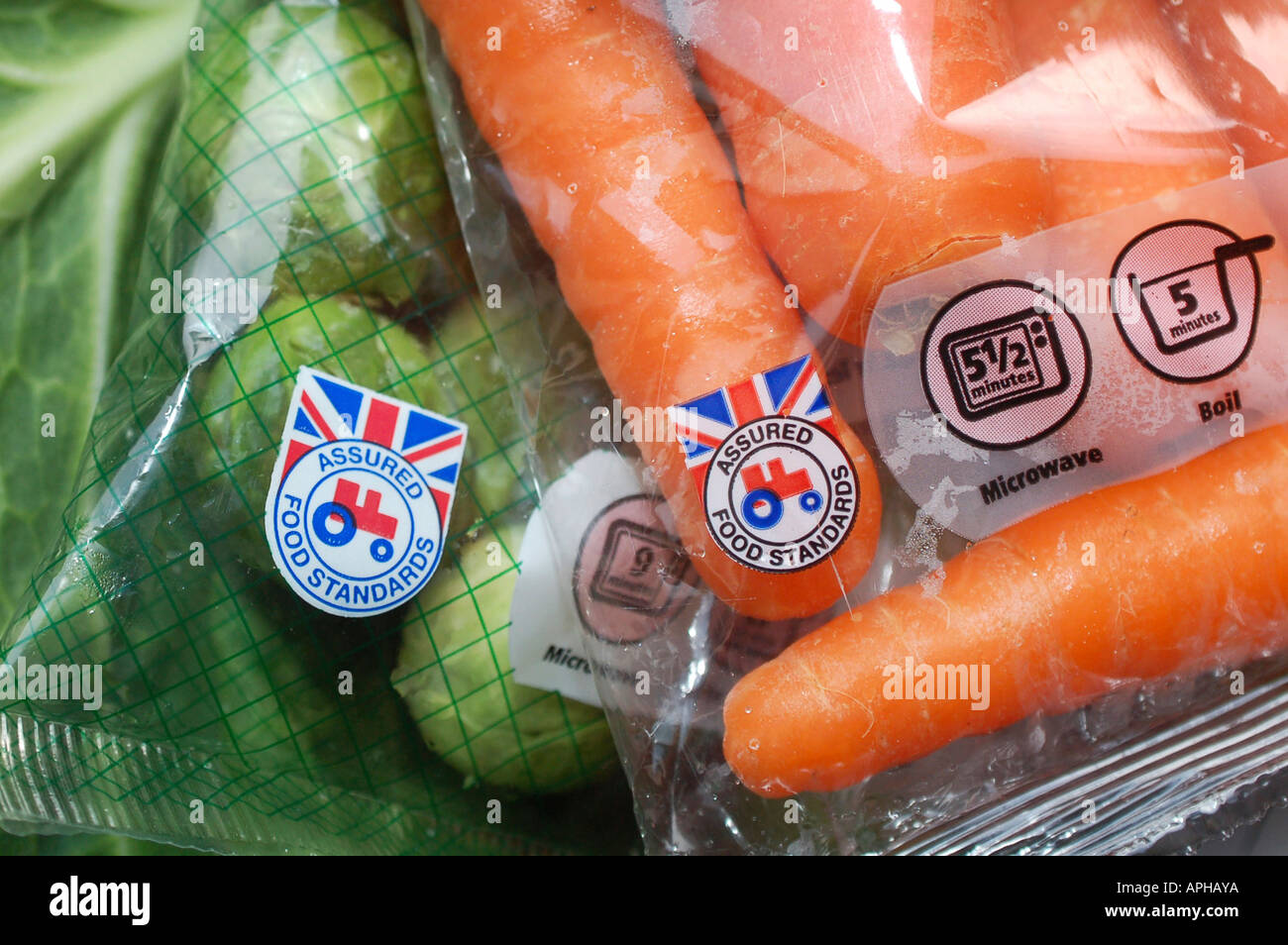 Red tractor label on British Assured Food Standards vegetables in the UK. Stock Photo